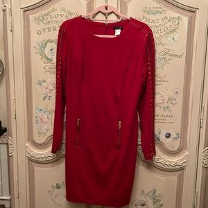 Lipstick red dress size 10 but runs somewhat larger knee length round neckline